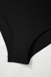 Close view of the black swimsuit brief lining beneath the skirt.