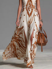 White and brown printed maxi dress showing front slit and flowing skirt