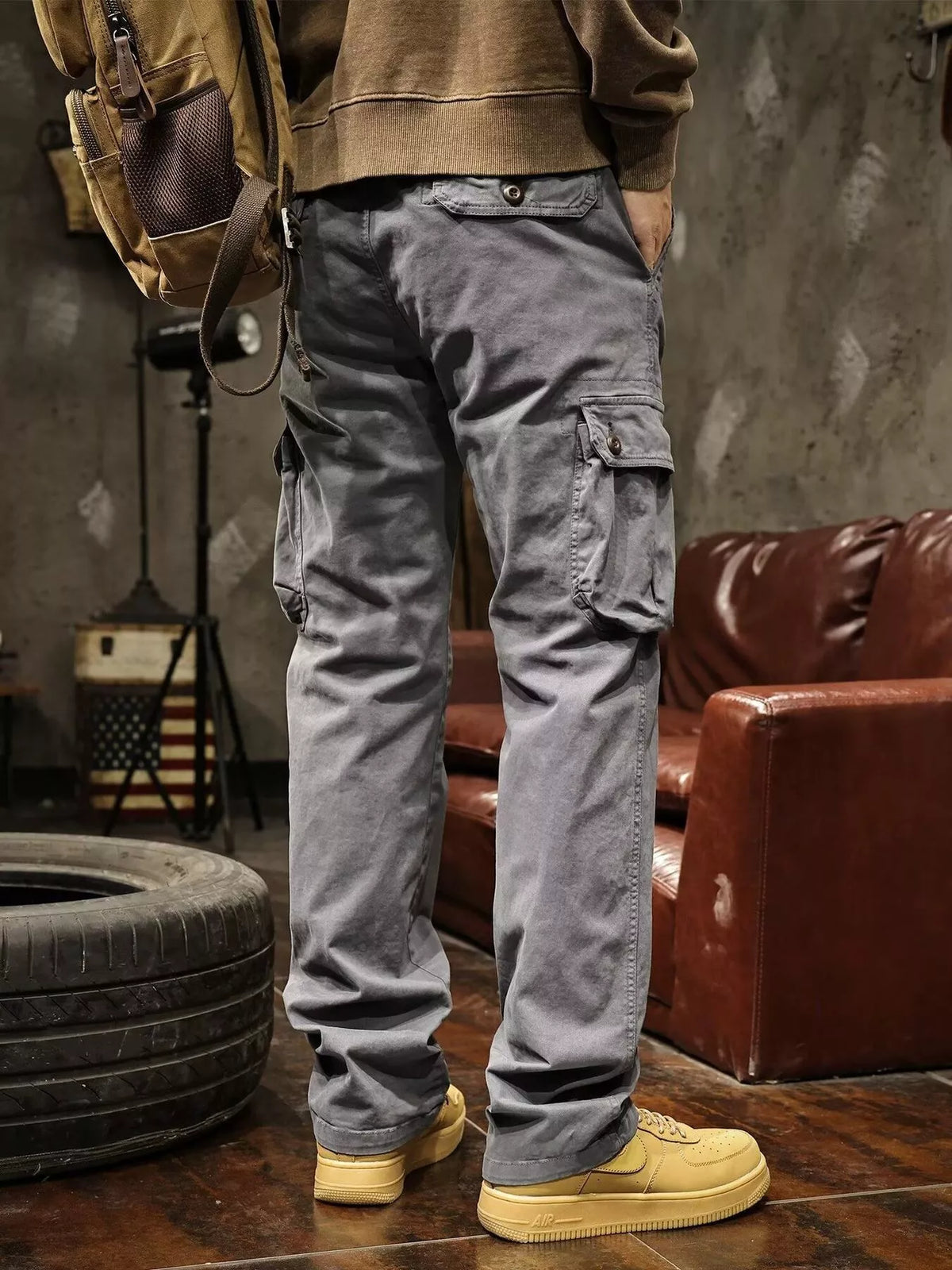 Back view of gray cargo pants showing rear and side cargo pockets.