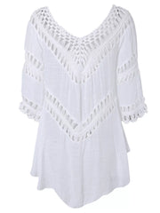 Detail of the crochet sleeve and hem trim on the white dress