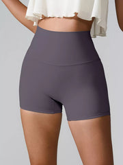 Back view of plum high-waist active shorts with fitted legs.