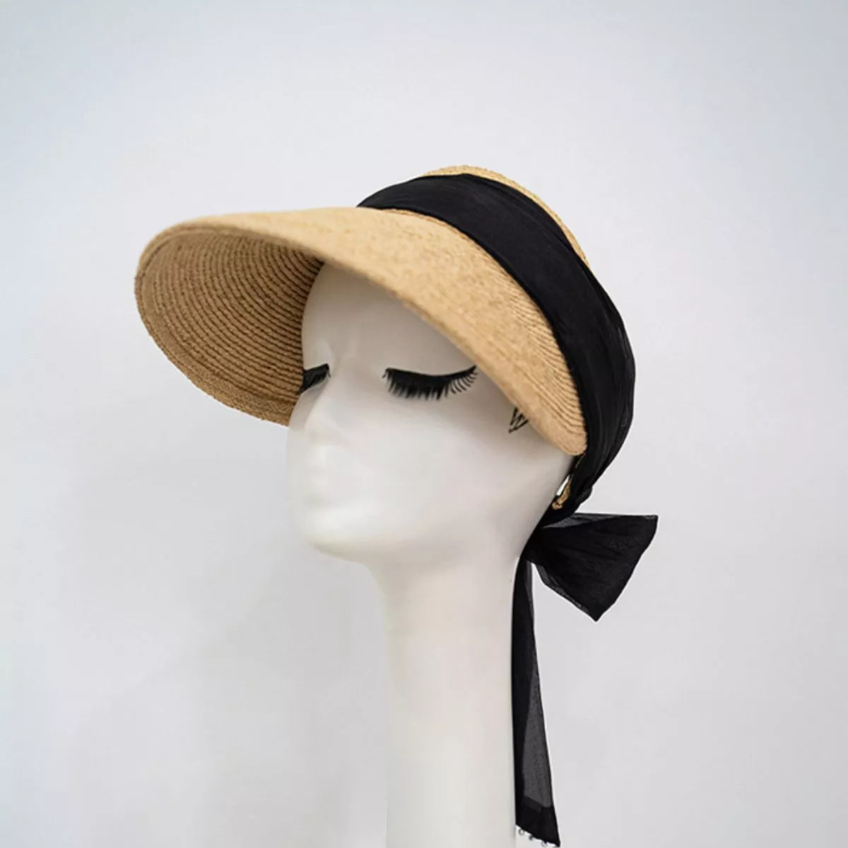 Black ribbon straw visor displayed on a mannequin head