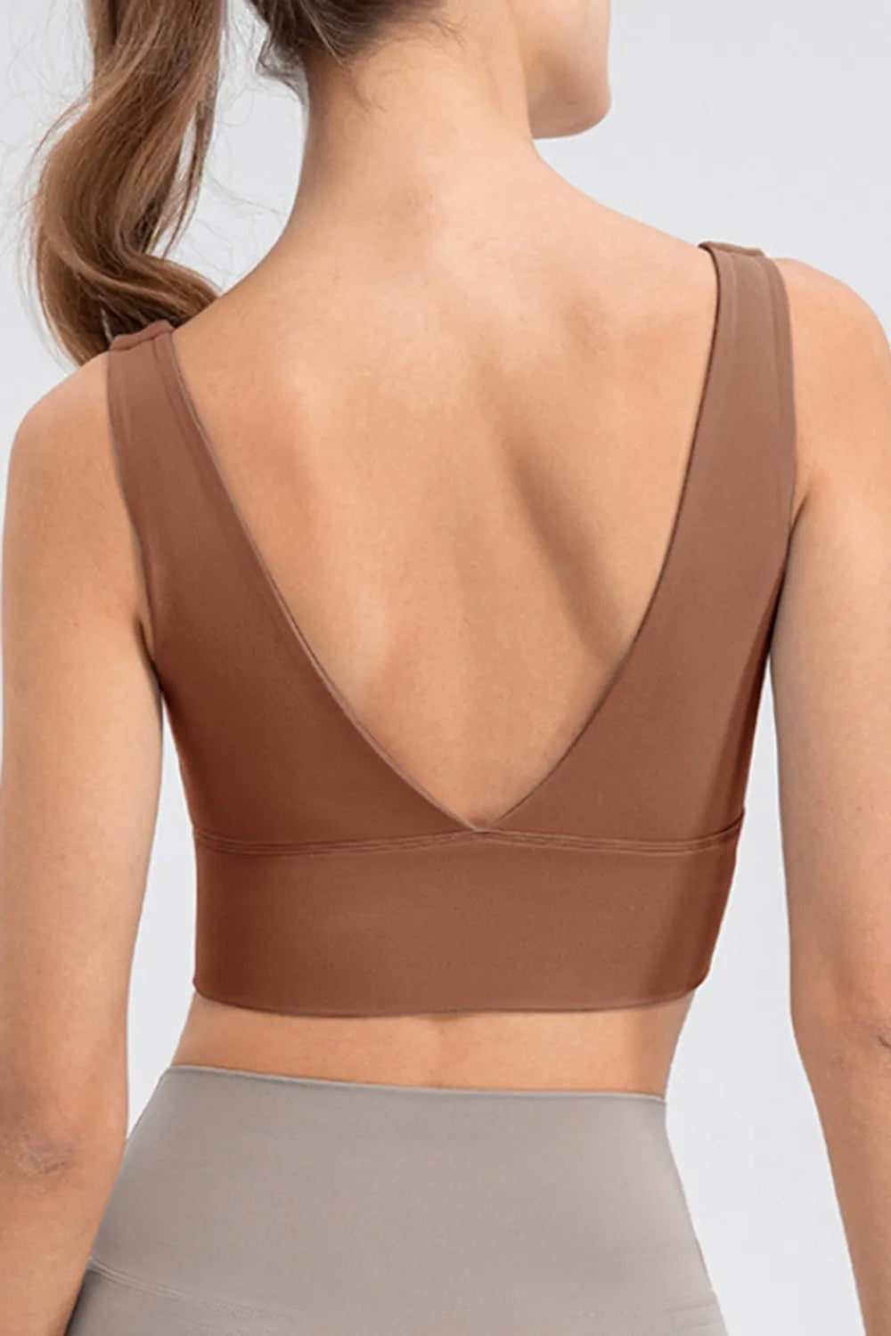 Back view of brown tank showing its deep V-back