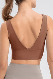 Back view of brown tank showing its deep V-back