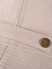 Close view of khaki hat side snap fastener and stitched band
