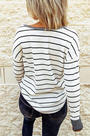 Back view of striped Henley top on model