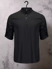Tan shirt worn with jeans, showing short button placket
