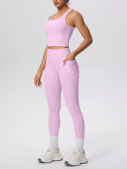 White tank and leggings shown from the front with hand in pocket