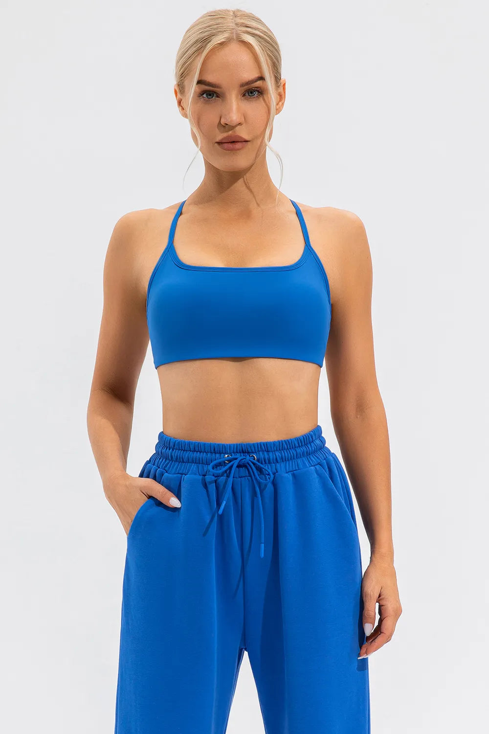 Blue crisscross spaghetti-strap active cami with matching pants