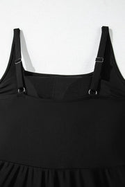 Close-up of the black swim dress square neckline and adjustable shoulder straps.