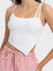 Side view of the peach slit-hem active cami