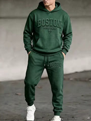 Model wearing green Boston hoodie and matching joggers