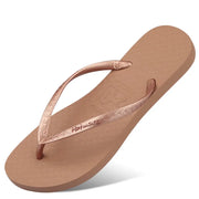 Tan flip-flop with rose-coloured toe-post straps and textured footbed