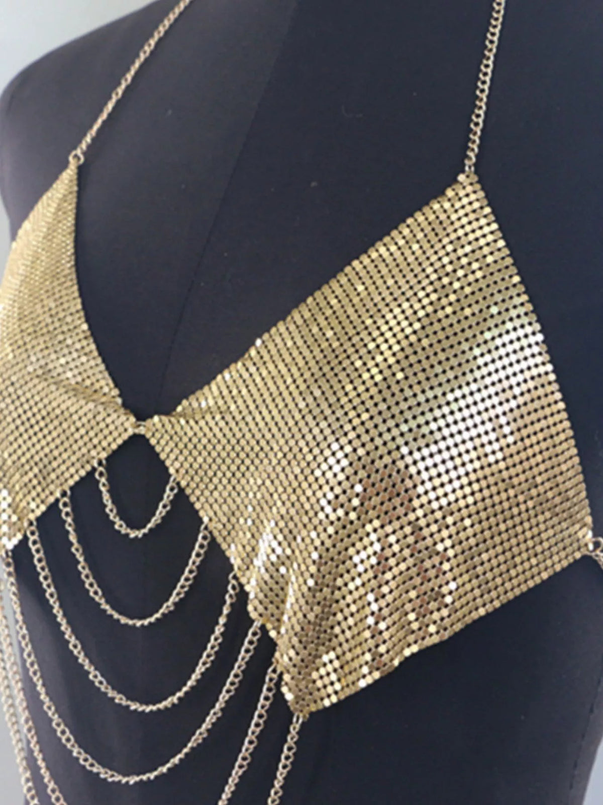 Gold chainmail halter top on display form, front
