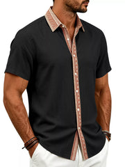 Model wearing black shirt with patterned rust collar and placket