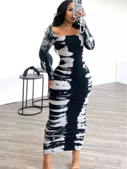 Black and white fitted tie-dye maxi dress shown in a mirror