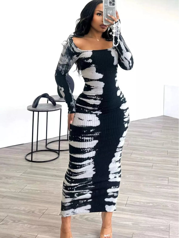Black and white fitted tie-dye maxi dress shown in a mirror