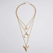 Full gold-tone layered necklace showing the clasp and three pendant chains