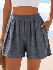 Front view of gray ribbed shorts with hand in pocket