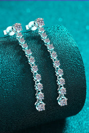 Adored 1.18 Carat Moissanite Long Earrings — Close-up of long earrings on teal display