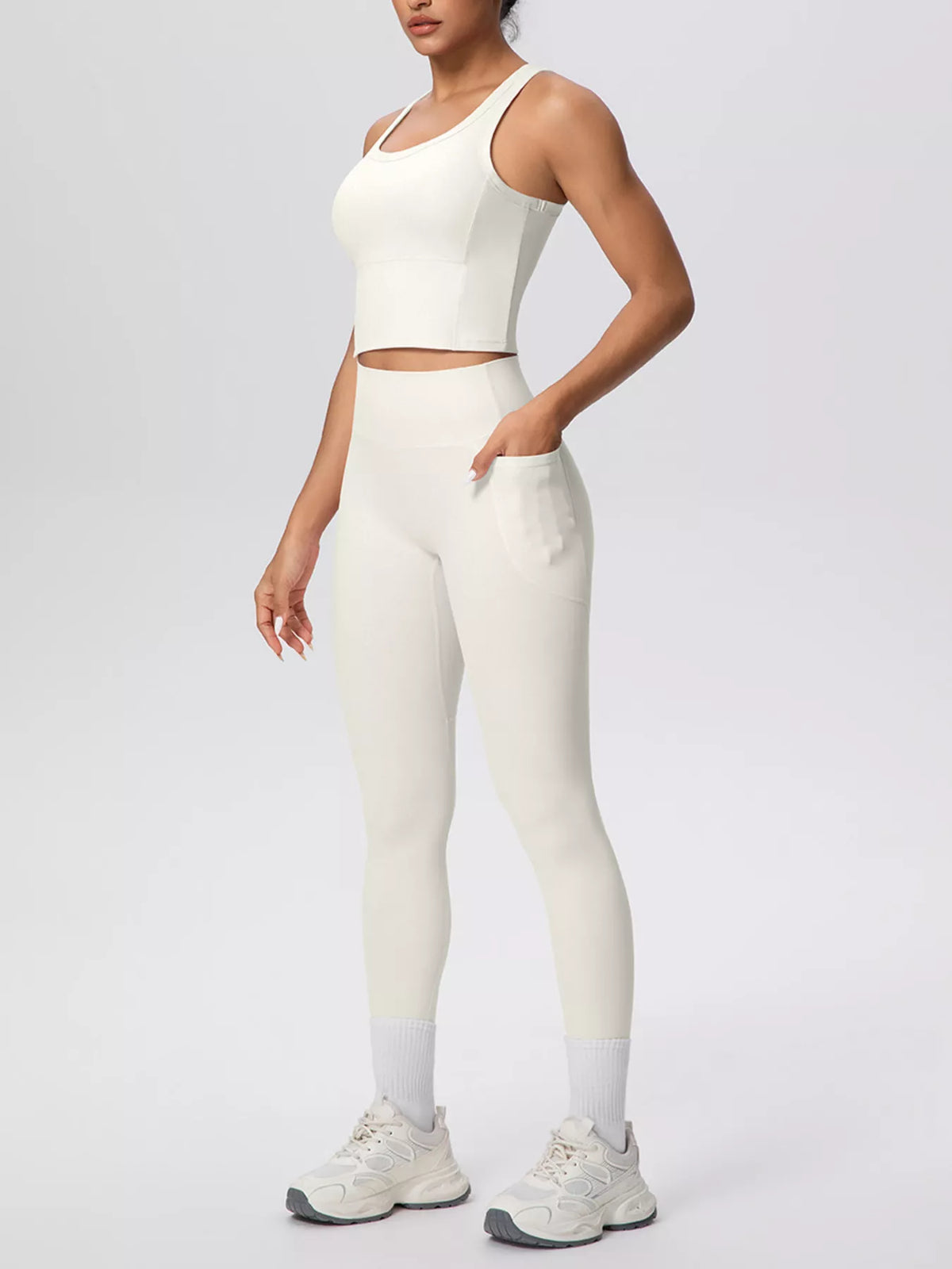 Cream leggings shown from the back at an angled pose