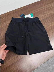 Black lightweight athletic shorts laid flat