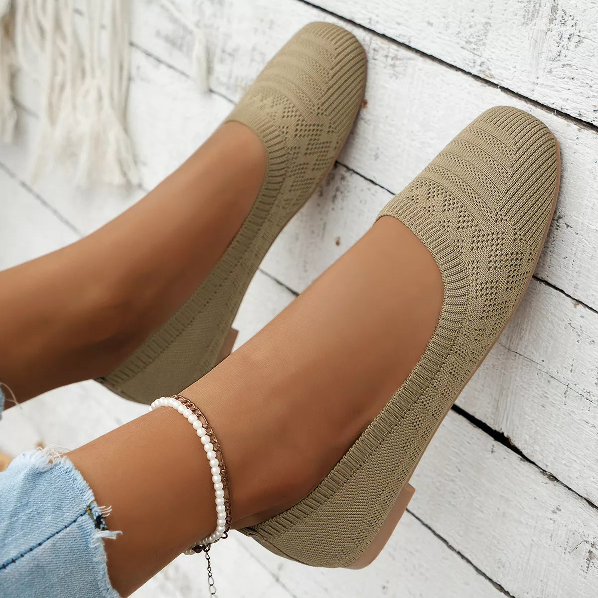 Khaki mesh flats worn from above with patterned uppers