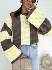 Front view of cream and dark brown oversized sweater with broad vertical panels