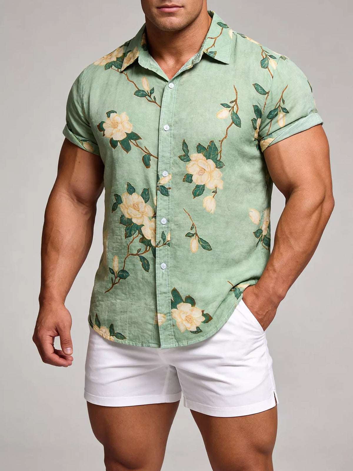 Model wearing a mint-green floral short-sleeve shirt