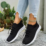 Black knit sneakers shown from the side