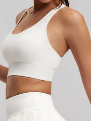 Close angled front view of white active bra showing the neckline and underbust seam