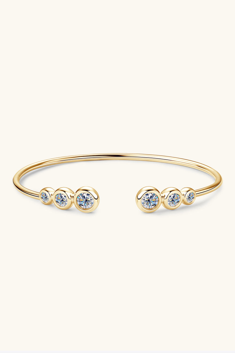 Gold-tone moissanite bracelet displayed in its presentation box