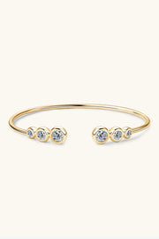 Gold-tone moissanite bracelet displayed in its presentation box