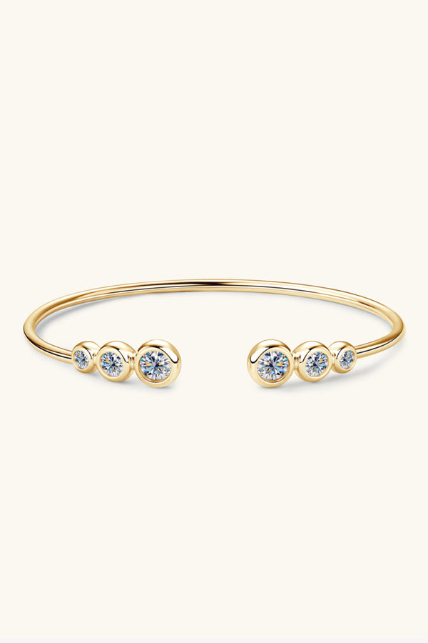 Gold-tone moissanite bracelet displayed in its presentation box