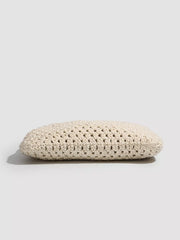 Bottom profile of the ivory crochet tote showing the thick crocheted base.