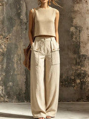 Beige sleeveless crop top and wide-leg cargo pants, front view