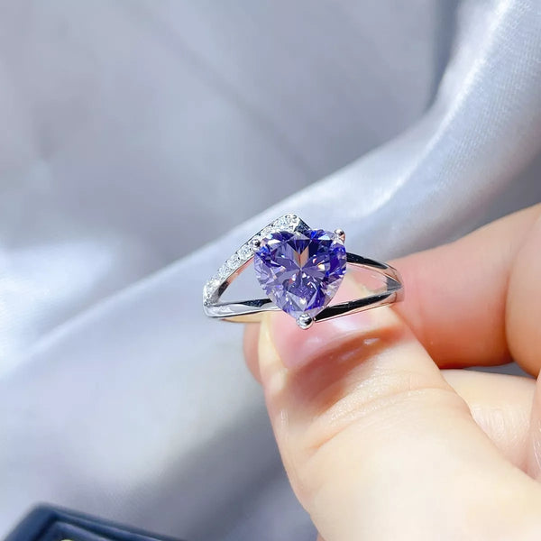 3 carat moissanite ring in sterling silver shown on a light surface