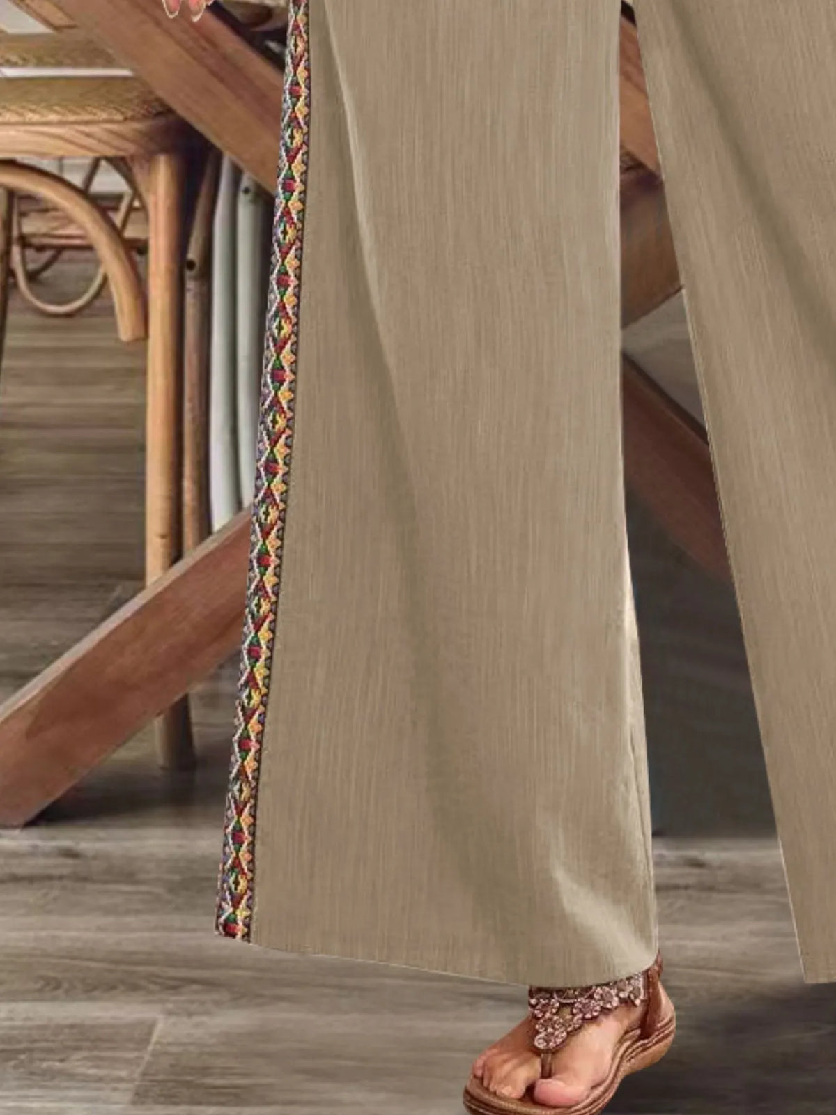Close-up of beige embroidered side stripe