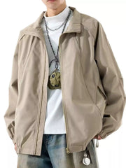 Model wearing beige zip-up jacket over a white T-shirt, front view
