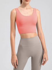 Pink cropped tank shown from the front with wide shoulder straps