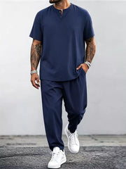 Model wearing navy short-sleeve top and matching pants