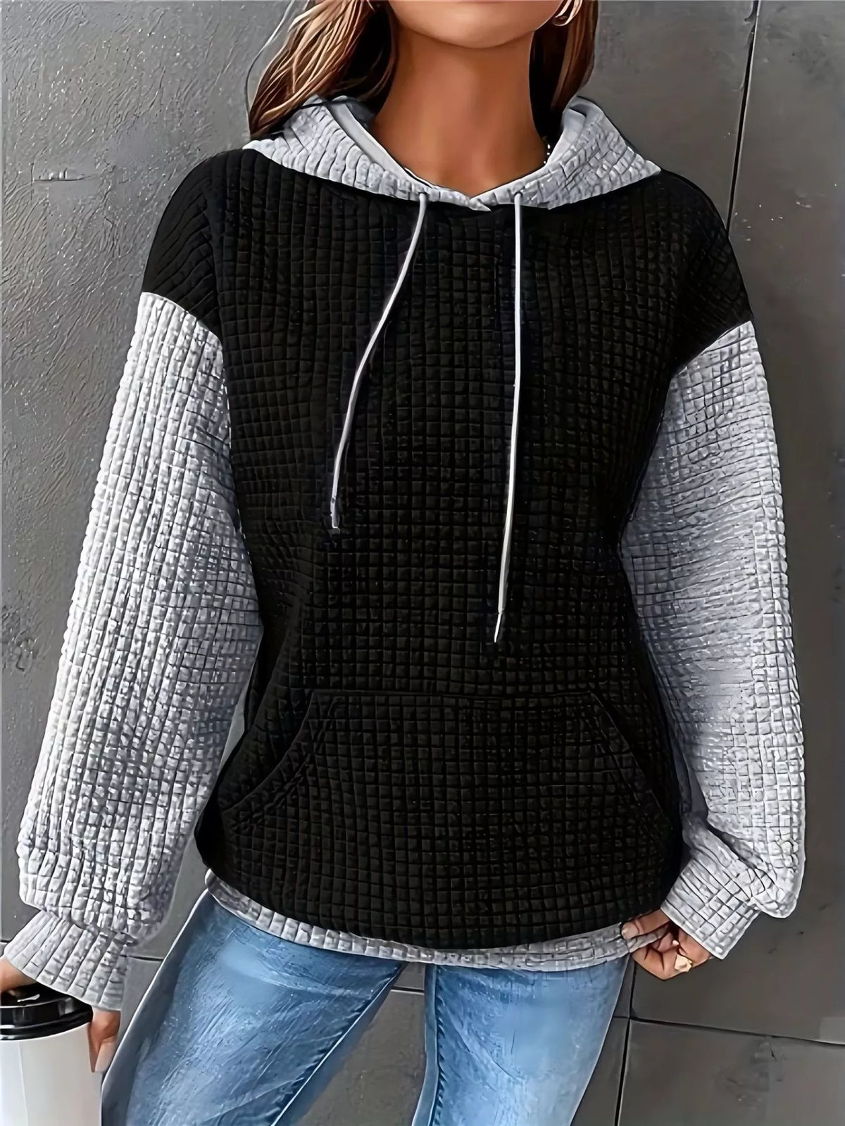 Black-and-white color-block hoodie with drawstrings