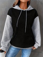 Black-and-white color-block hoodie with drawstrings