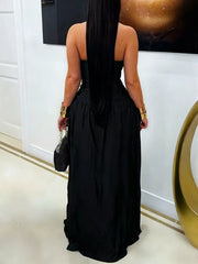 Back view of black halter maxi dress with open back and front slit