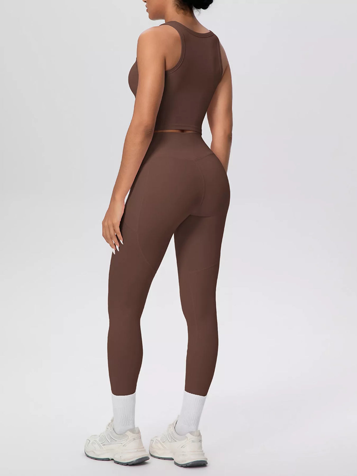 Cream tank and leggings in side view with phone in pocket