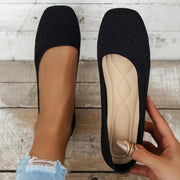 Black square-toe mesh flats shown from above with one sole visible