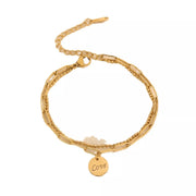 Gold-tone chain bracelet with dangling LOVE letter charm