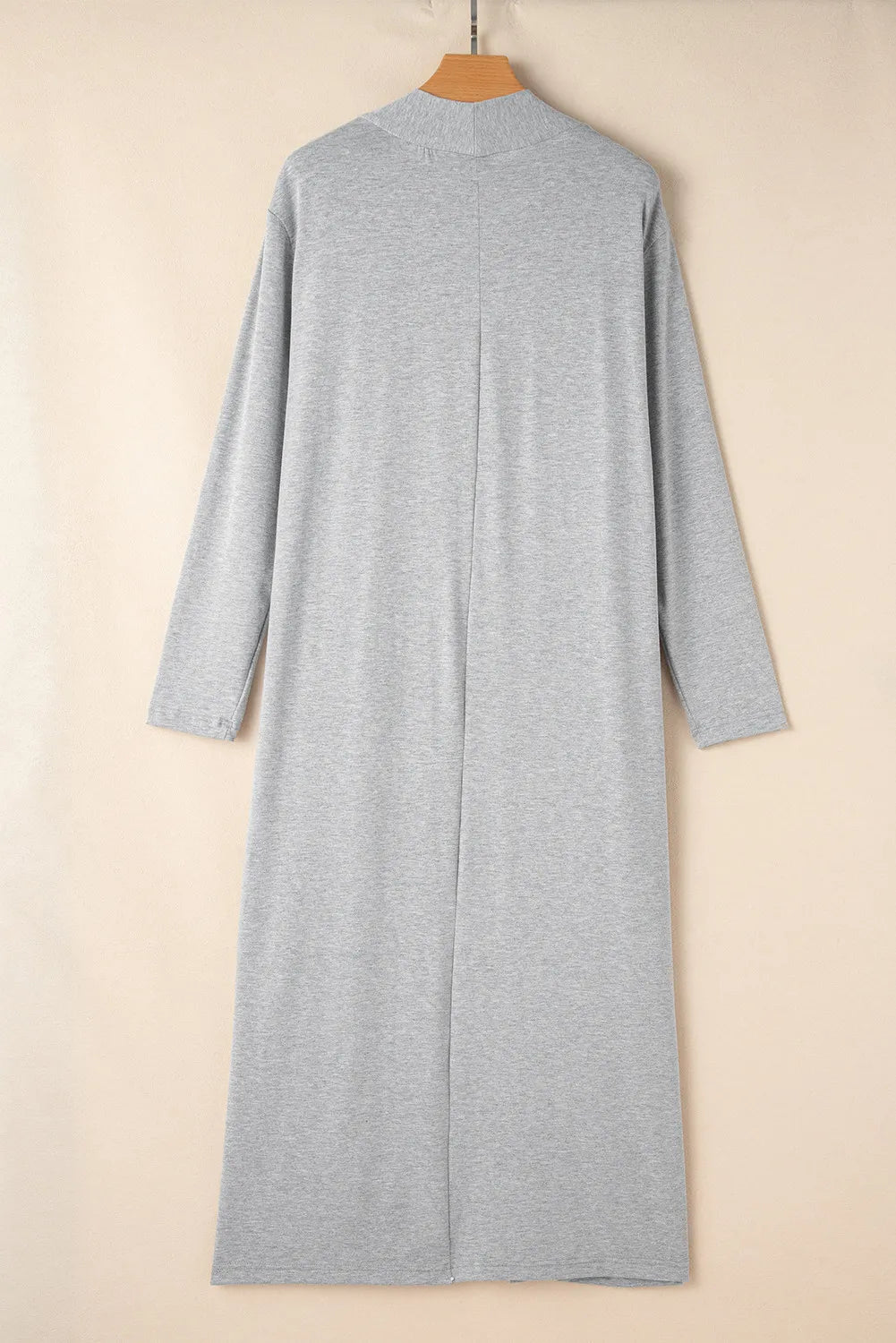 Gray open-front long cardigan displayed on a wooden hanger