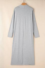 Gray open-front long cardigan displayed on a wooden hanger