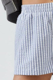 Close-up of blue stripe fabric and shorts hem